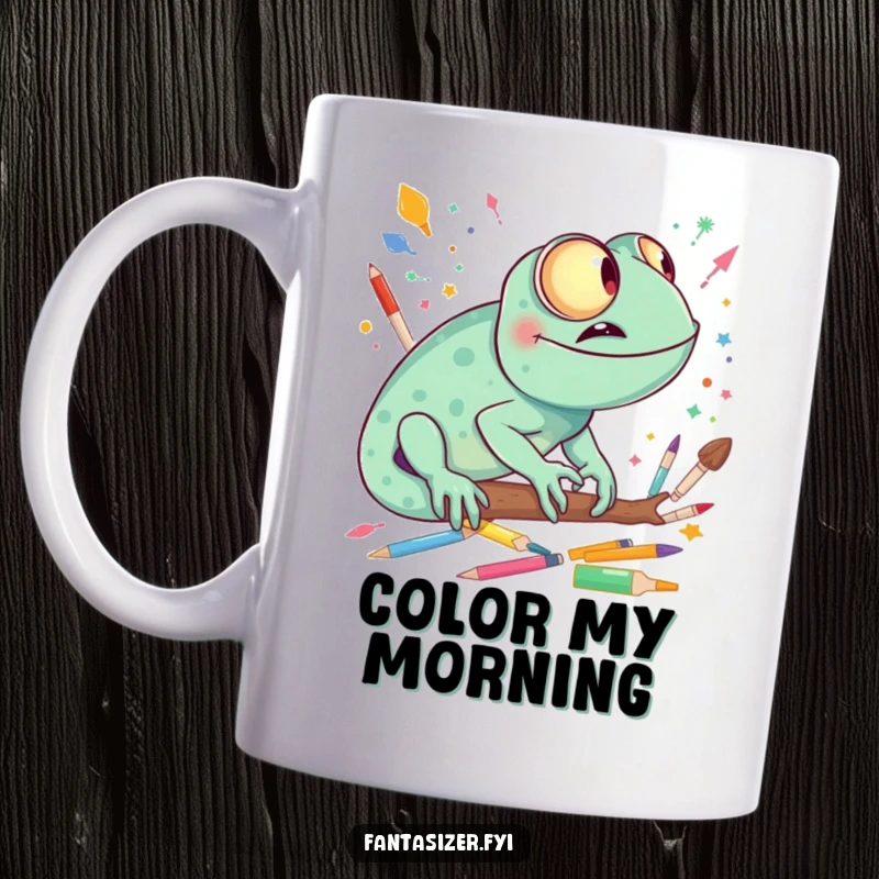 Funny giggling chameleon imagining a world made of colorful art supplies, a creative and humorous mug.