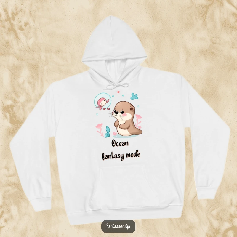 Funny hoodie showcasing a curious otter blissfully dreaming of swimming with mermaids in an enchanting underwater world.